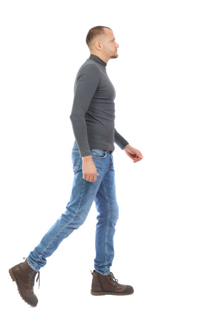 istock Back view of going  handsome man. walking young guy . 912923770