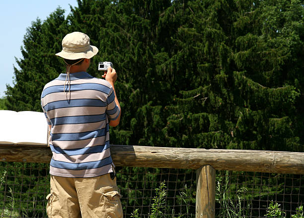 istock Vacation Snapshots: Man in hat at Overlook Taking Picture 91292454