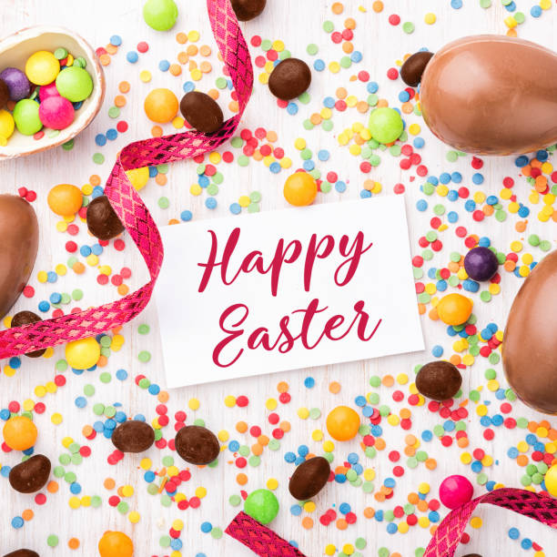 istock Easter chocolate egg with colorful candies. 912924598