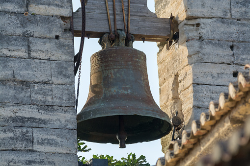 Big bell on the old stone fortress wall