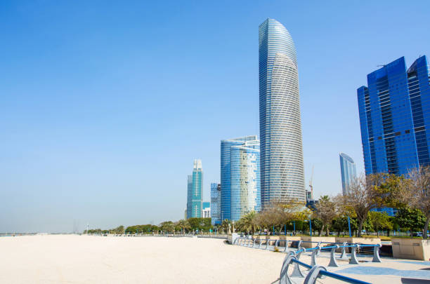 istock Abu Dhabi Corniche beach and walking area with landmark view of 912925184