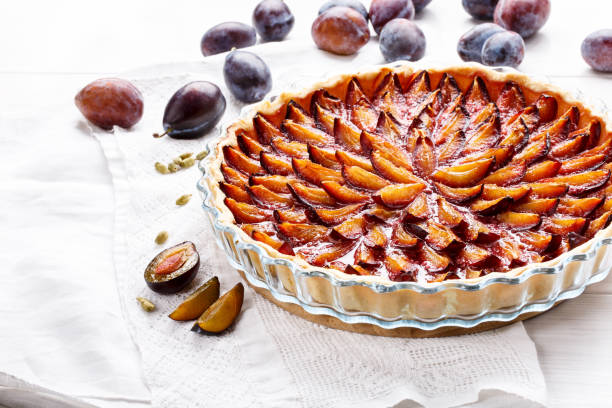 istock Homemade plum pie. Fruit tart on white table. Copy space. 912927860