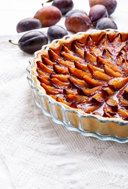 istock Homemade plum pie. Fruit tart on white table. Copy space. 912927892