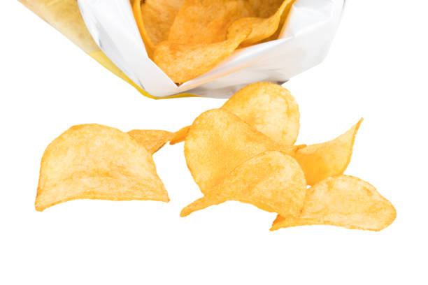 istock Potato chips poured out from packing on a white background 912931568