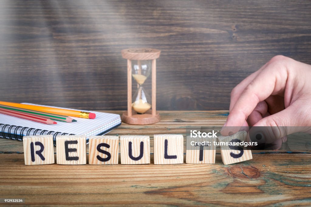 results. Wooden letters on the office desk, informative and communication background results. Wooden letters on the office desk, informative and communication background. Solution Stock Photo