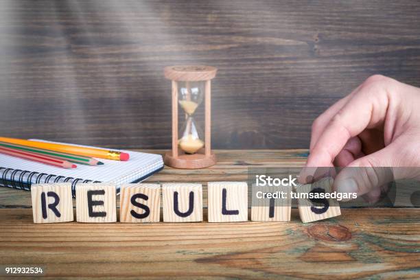 Results Wooden Letters On The Office Desk Informative And Communication Background Stock Photo - Download Image Now