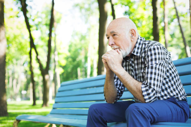 Pensive senior man outdoors
