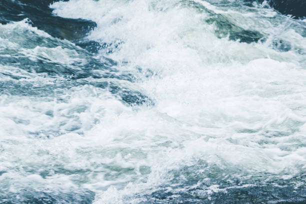 istock A powerful stream of mountain river. The fast current of water. 912935996