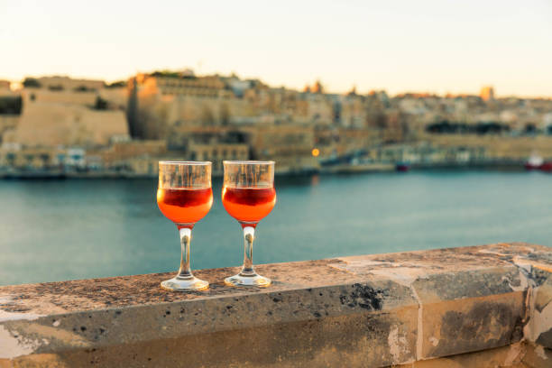 Sunset over Valletta with wine glasses