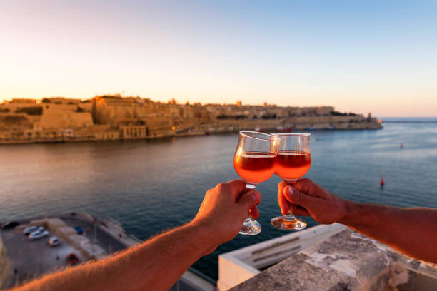 Sunset over Valletta with wine glasses