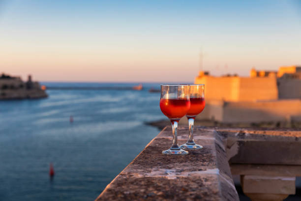 Sunset over Valletta with wine glasses