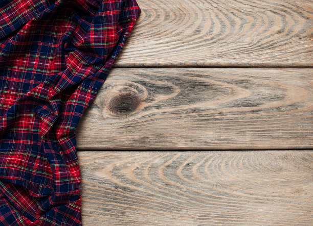 istock Checkered napkin on a wooden background 912936538