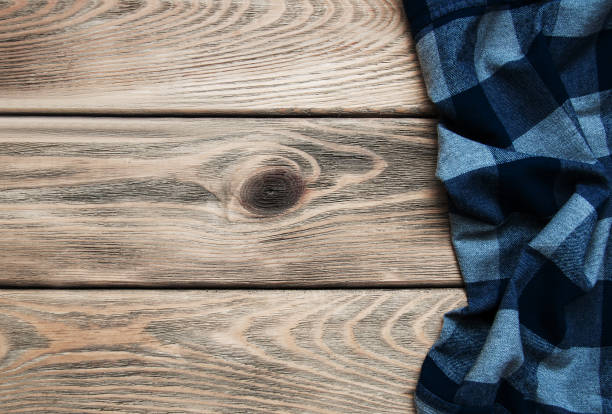 istock Checkered napkin on a wooden background 912936848