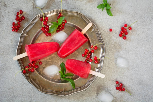 istock Homemade ice cream, popsicle of red currant smoothies. 912937322