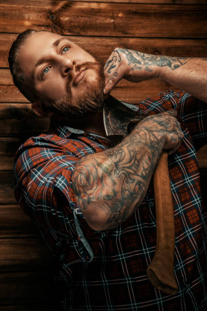istock Portrait of bearded tattooed man 912938044