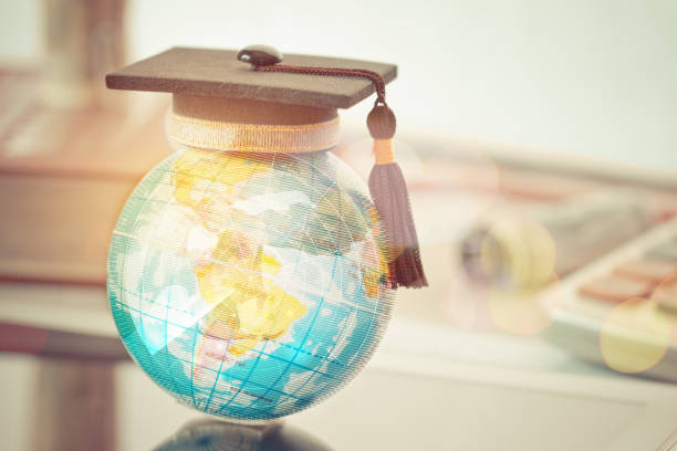 istock Graduate study abroad concept, Graduation cap on top Earth globe model map with Radar background. Graduate study abroad program and Back to School and Studies lead to success in world wide. 912945452
