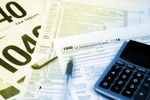 istock tax form 1040 with calculator, monochrome image 912949266