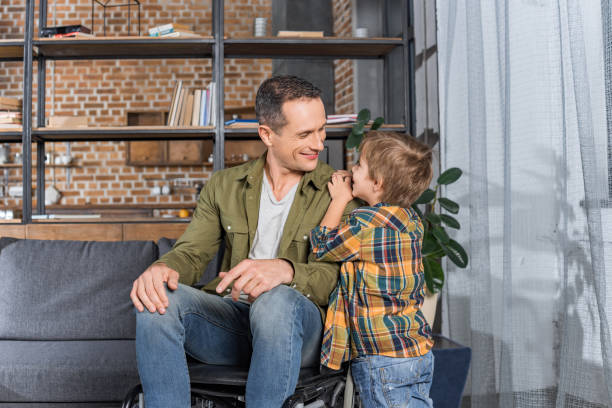 istock father in wheelchair and son 912955304