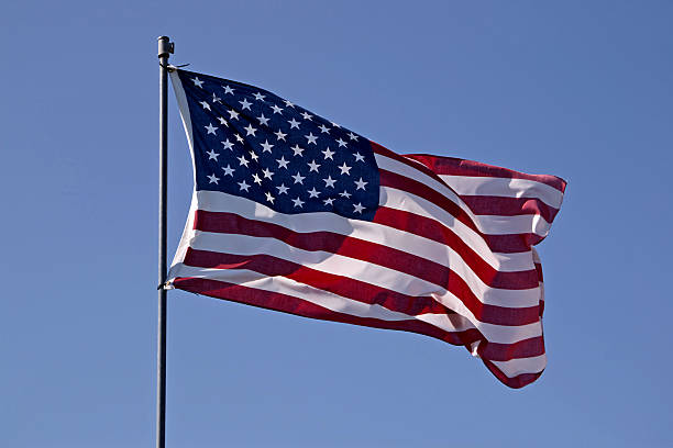 istock American flag against blue sky 91296016