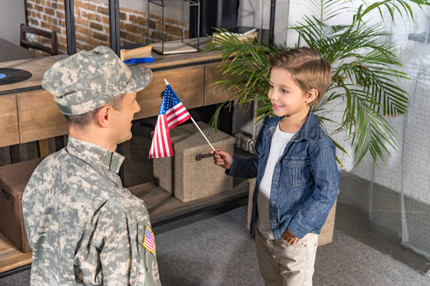 istock military father and son with usa flag 912960780