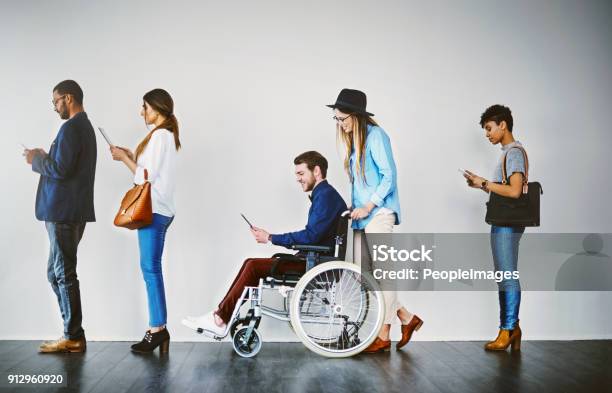 This Interview Is Open To Everyone Stock Photo - Download Image Now - Disability, Multiracial Group, Wheelchair