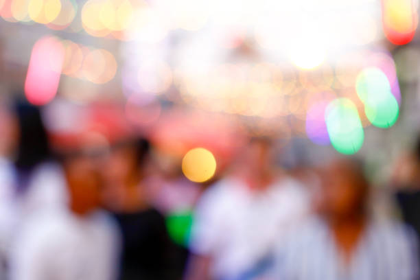 istock City commuters. High key blurred image of workers going back home after work. Unrecognizable faces, bleached effect. 912961392