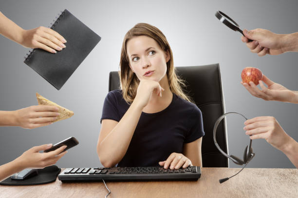 istock business woman sitting at desk 912963378