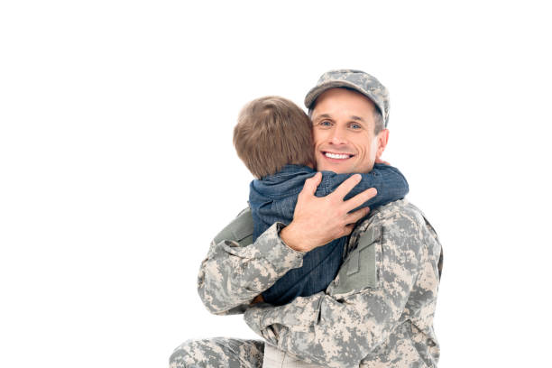 istock father in military uniform embracing with son 912970062