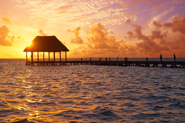 istock Holbox island sunset beach pier hut Mexico 912970252