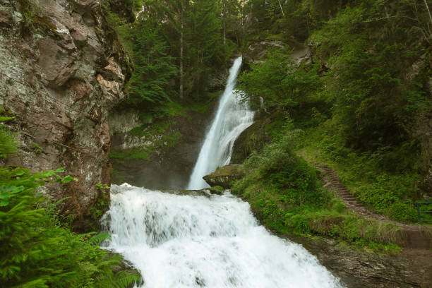 istock waterfall in the Italian Alps 912976070