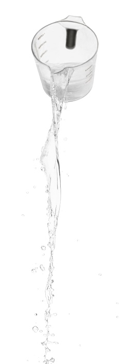 Water Spilling Out Of A Measuring Jug