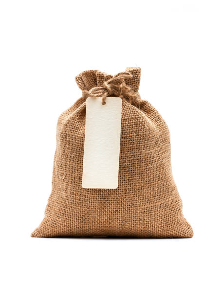 istock Burlap sack with blank label isolated on white background 912979402