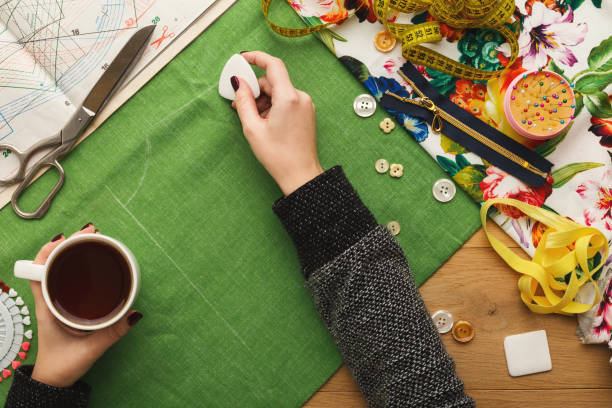 istock Top view on fashion designer working at messy table 912985904