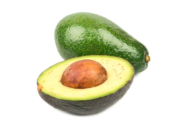 avocado hass con metà - avocado cross section vegetable seed foto e immagini stock