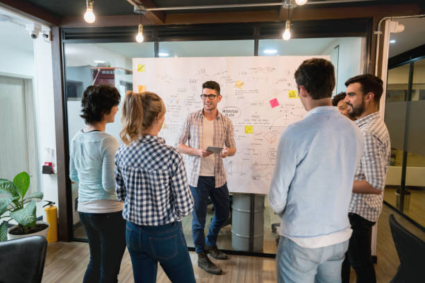 istock Man making a presentation in a business meeting at the office 912986510