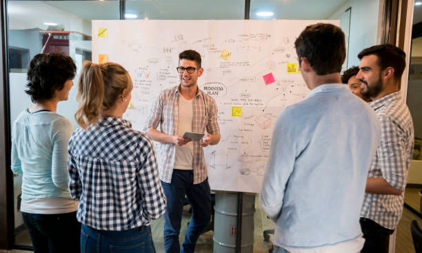 istock Man talking in a business meeting at a creative office 912986550