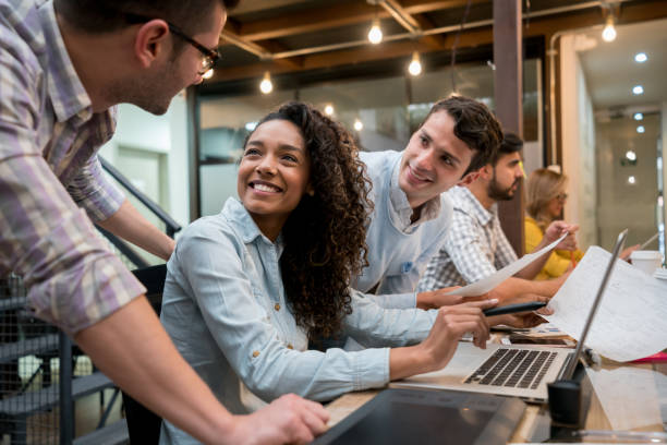 istock Happy group of people working together at a creative office 912986744