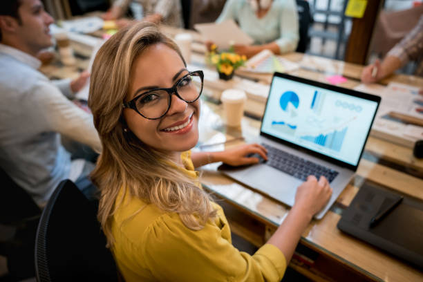istock Happy woman working online at a creative office 912986796