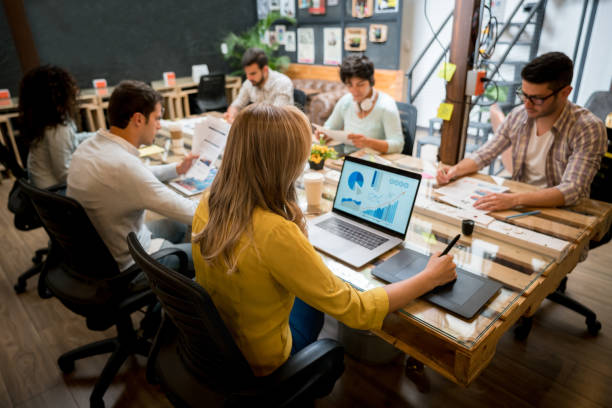 istock Group of people working at a creative office 912986800