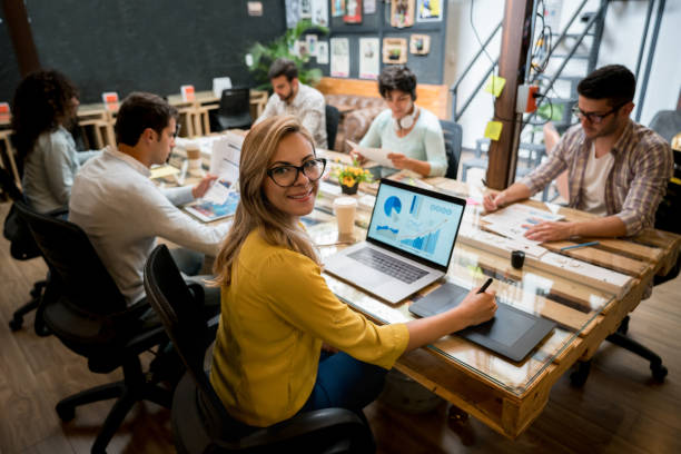 istock Happy woman working online at a creative office 912986824