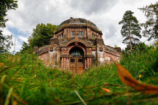 Old overgrown mausoleum at the Ohlsdorf Cemetery, Hamburg, Germany