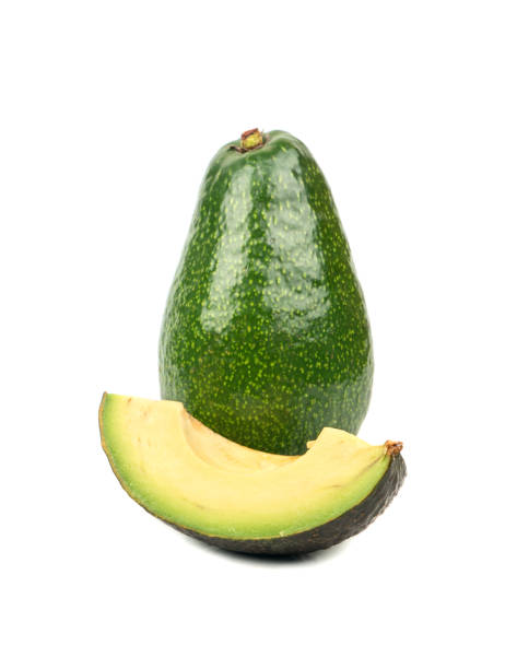 avocado con fetta - avocado cross section vegetable seed foto e immagini stock