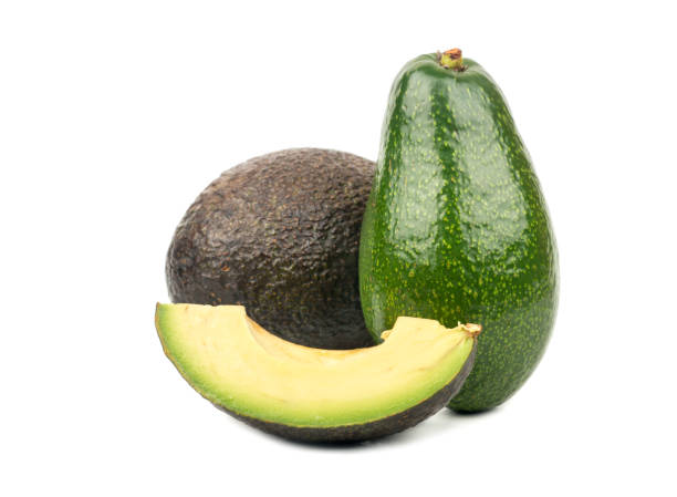 avocado con fetta - avocado cross section vegetable seed foto e immagini stock