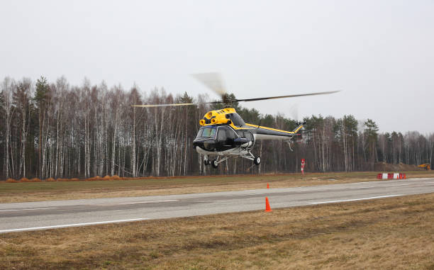istock The aircraft - Big yellow black white helicopter flight at low height 912993370