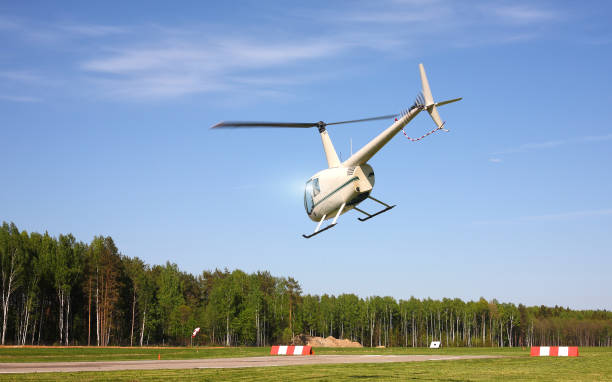 istock The aircraft - White helicopter makes flight at low height. 912993534
