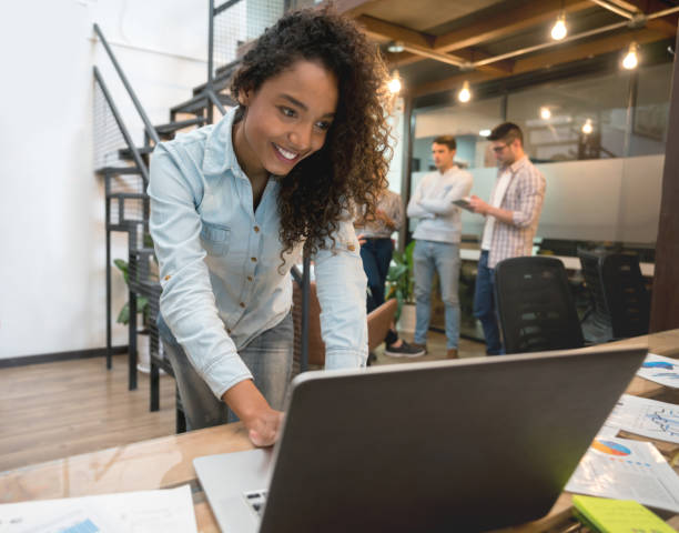 istock Happy woman working online at a creative office 912996402