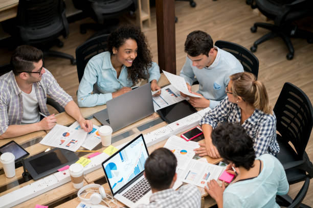 istock Casual business people working together at a creative office 912996626