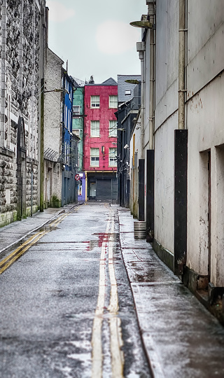 A small, sinister and empty alley in Cork, Ireland.