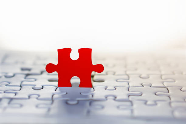istock business concept background with red jigsaw piece and white background idea for teamwork 913001192