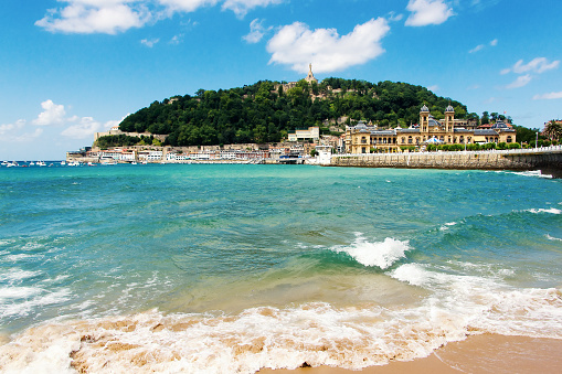 View of sandy beach of San Sebastian (Donostia), Spain in a lovelyl summer day. San Sebastian is one of the most famous tourist destinations in Spain